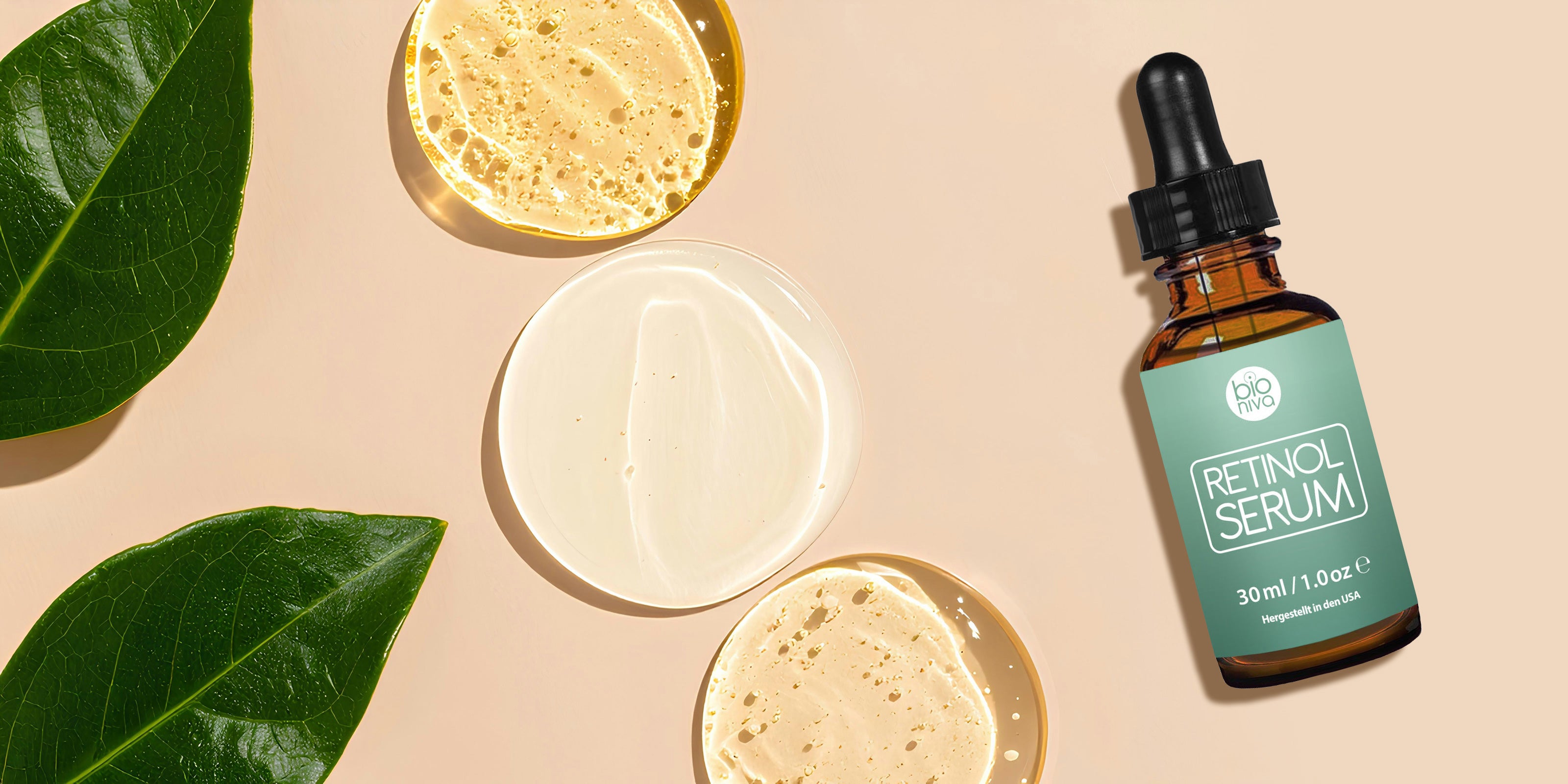 Retinol serum bottle with green label on a beige background with leaves